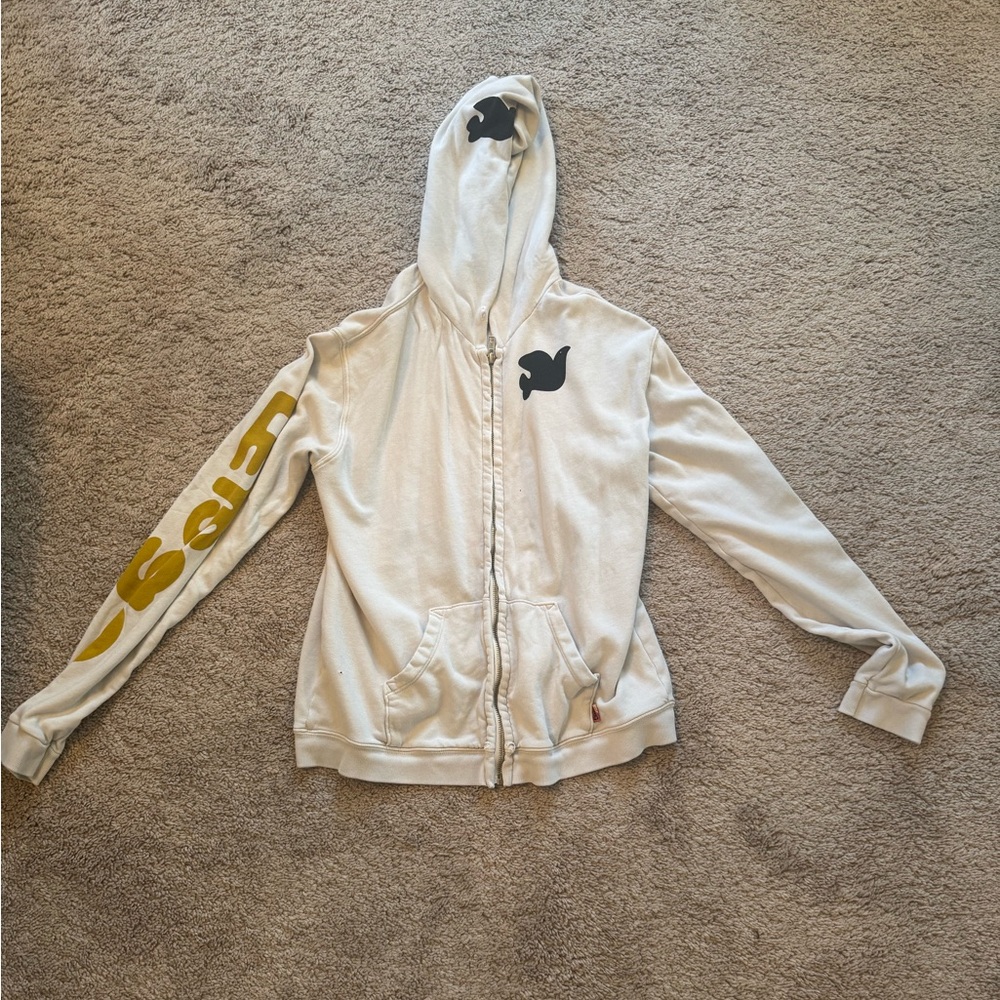 Free city zip up cream with black and yellow writing